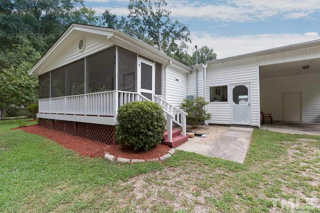 801 Sunny Lane Raleigh, NC 27603 - Photo 2 of 25 a view of a house with a yard