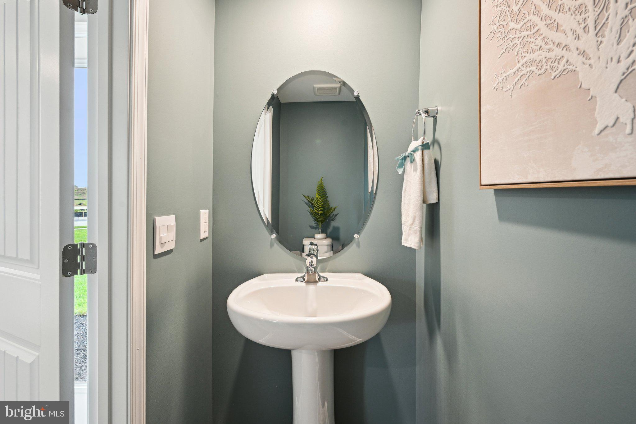 505 Colette Street Ellendale, DE 19941 - Photo 30 of 30 a bathroom with a sink and a mirror
