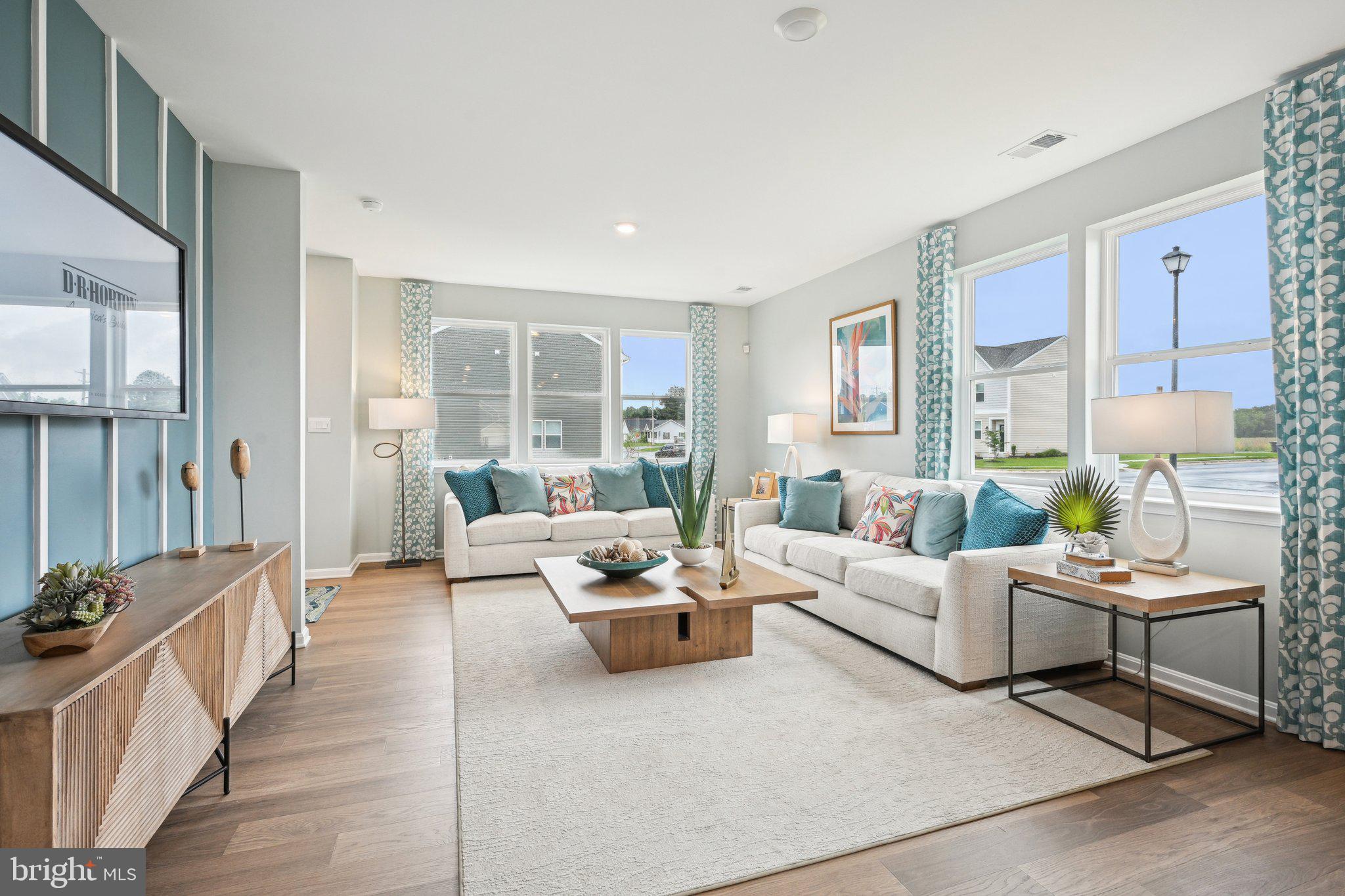 505 Colette Street Ellendale, DE 19941 - Photo 8 of 30 a living room with furniture and a large window