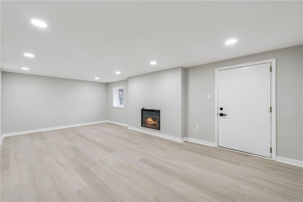 4531 Ridgeview Drive Greensburg, PA 15601 - Photo 26 of 41 a view of a big room with wooden floor and fireplace