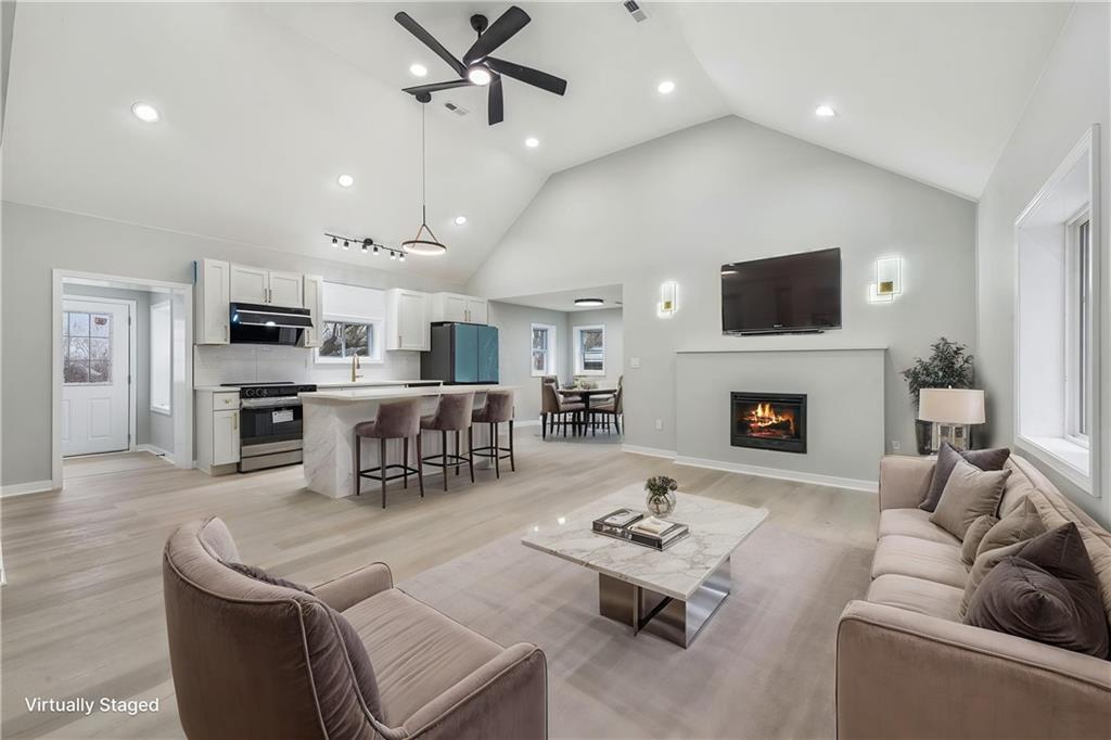 4531 Ridgeview Drive Greensburg, PA 15601 - Photo 7 of 41 a living room with furniture a fireplace and a flat screen tv