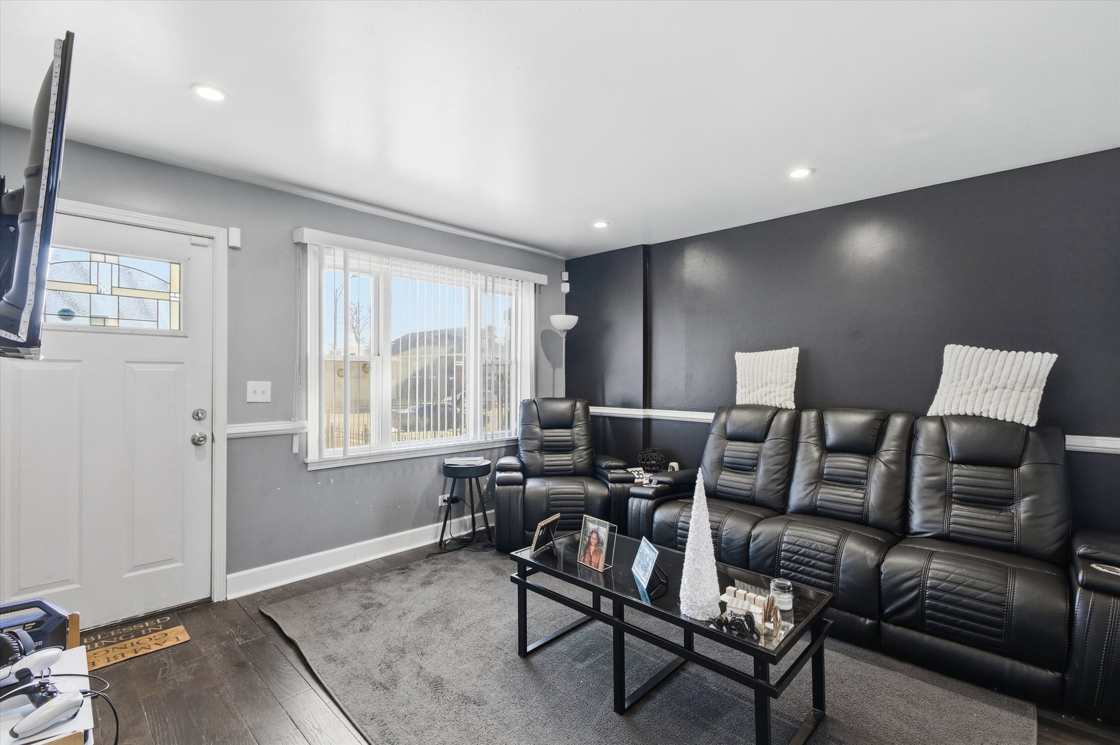 9904 South State Street, Unit B Chicago, IL 60628 - Photo 4 of 23 a media room with lots of chairs a lamp and a window