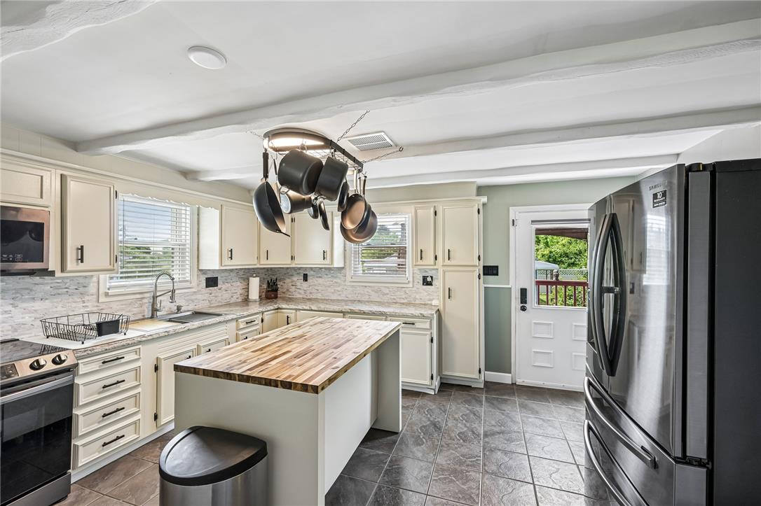 4065 Airport Road Allentown, PA 18109 - Photo 8 of 28 Brightly illuminated kitchen with ample counter space and convenient island for meal prep.