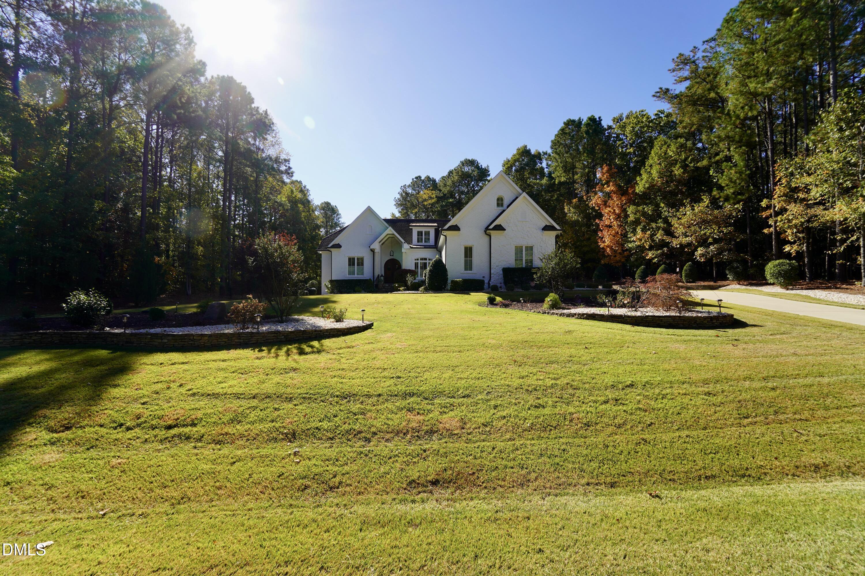 2604 Homestead Forest Road Zebulon, NC 27597 - Photo 12 of 101 a view of a swimming pool with an outdoor space and seating area