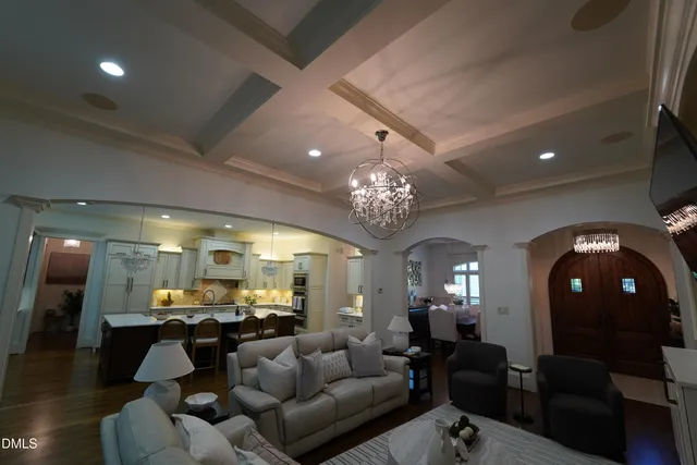 a room with gym equipment and a view of living room