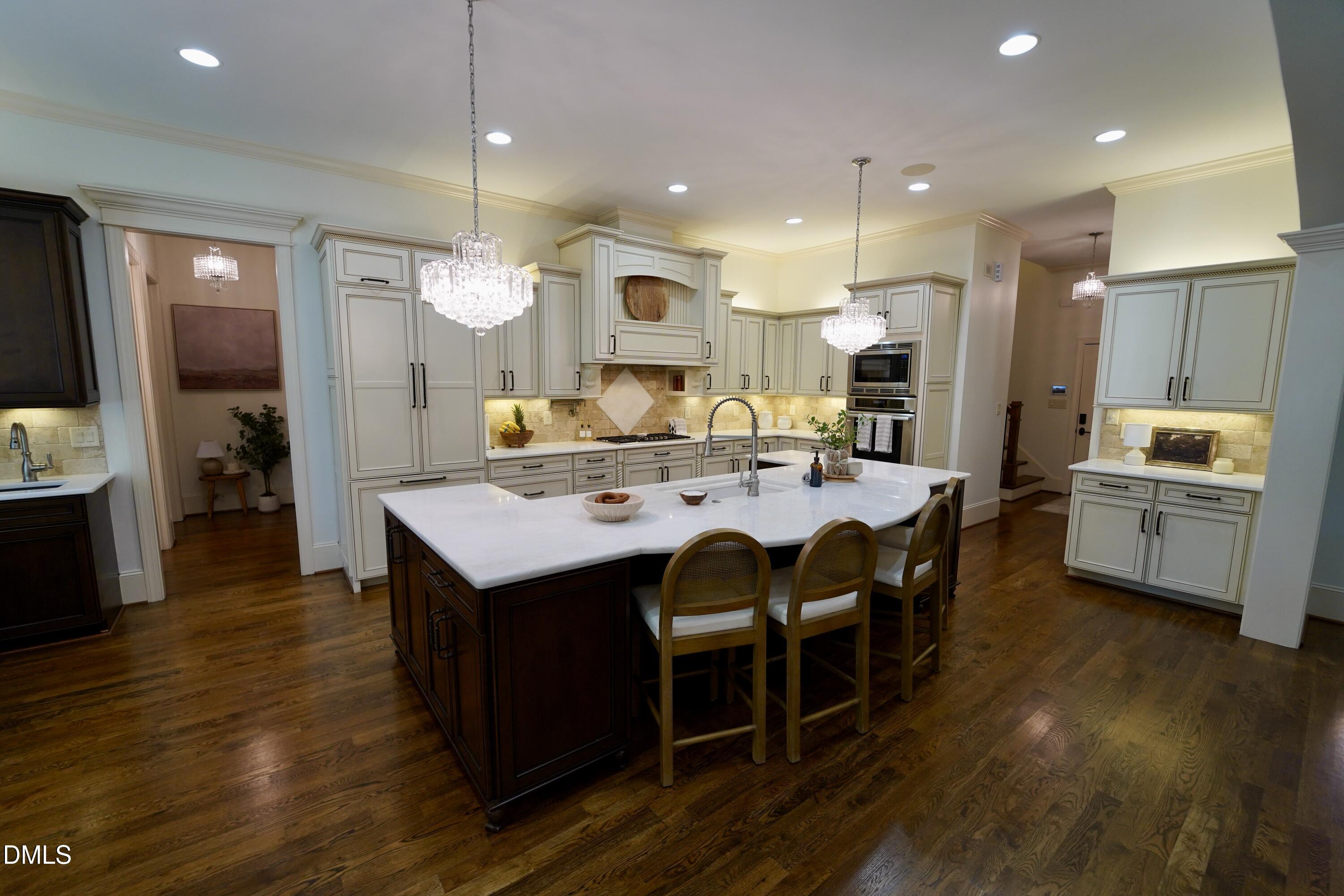 2604 Homestead Forest Road Zebulon, NC 27597 - Photo 36 of 101 a large kitchen with a table and chairs