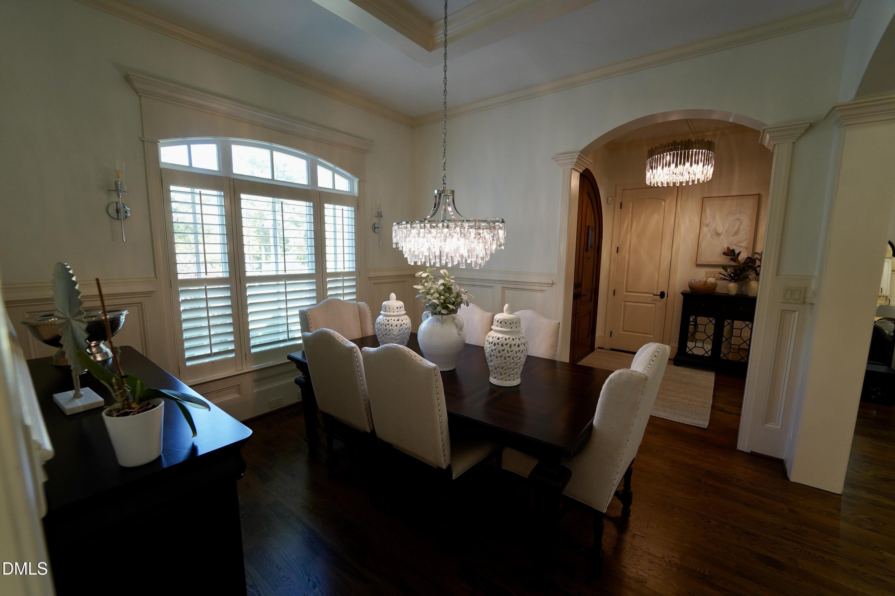 2604 Homestead Forest Road Zebulon, NC 27597 - Photo 46 of 101 a view of a dining room with furniture and wooden floor