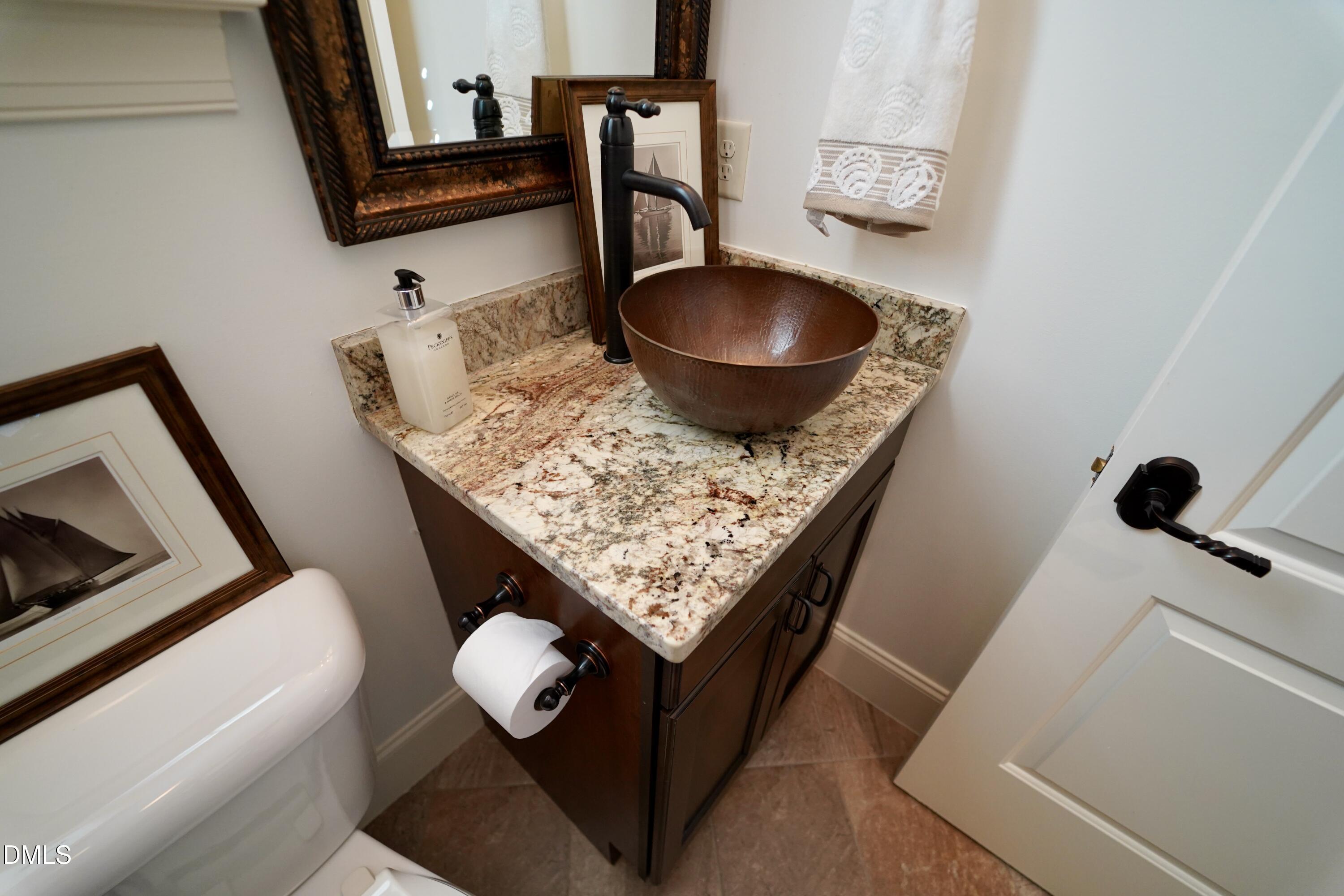 2604 Homestead Forest Road Zebulon, NC 27597 - Photo 62 of 101 a living room with furniture and a wooden floor