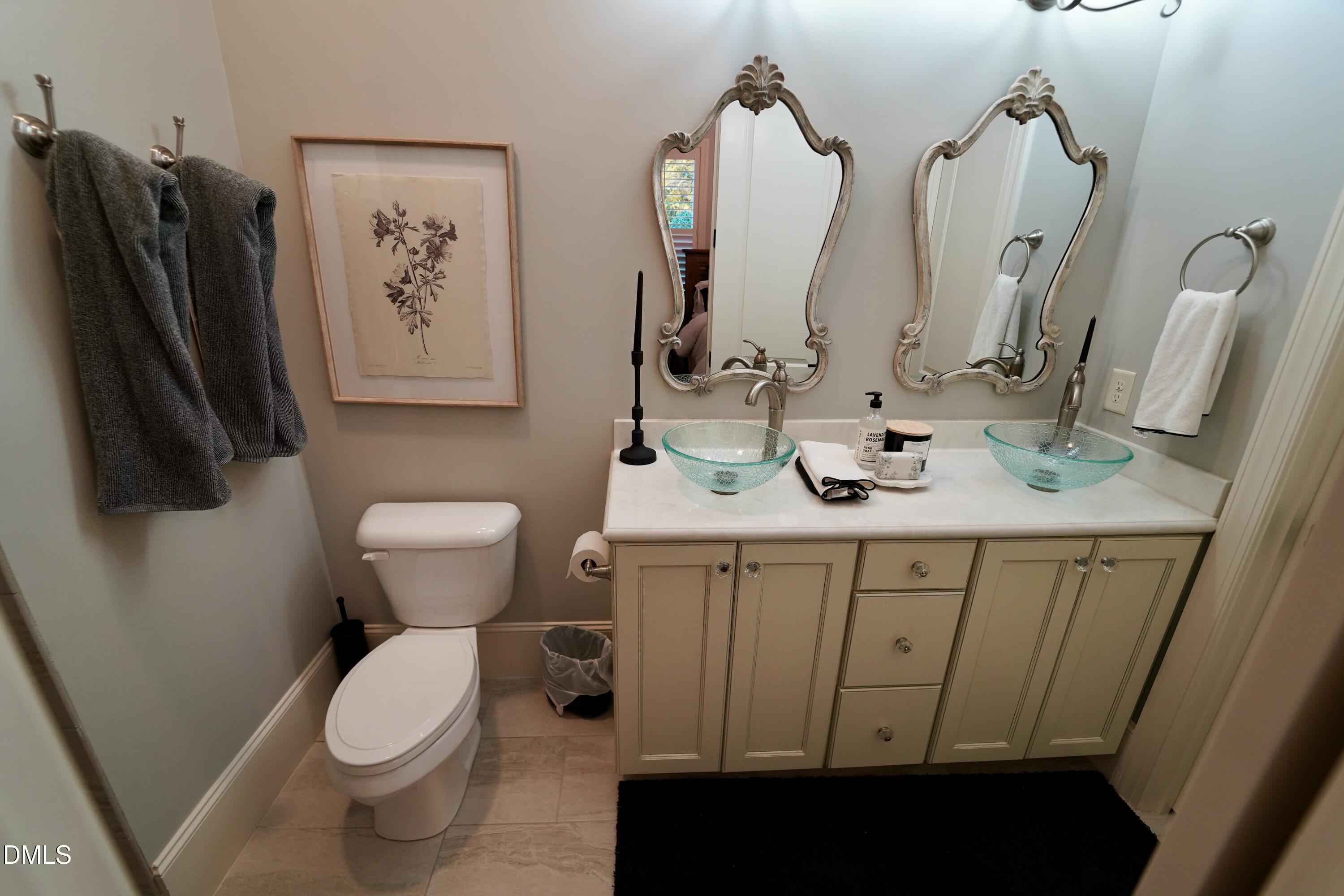 2604 Homestead Forest Road Zebulon, NC 27597 - Photo 75 of 101 a bathroom with a sink and a mirror