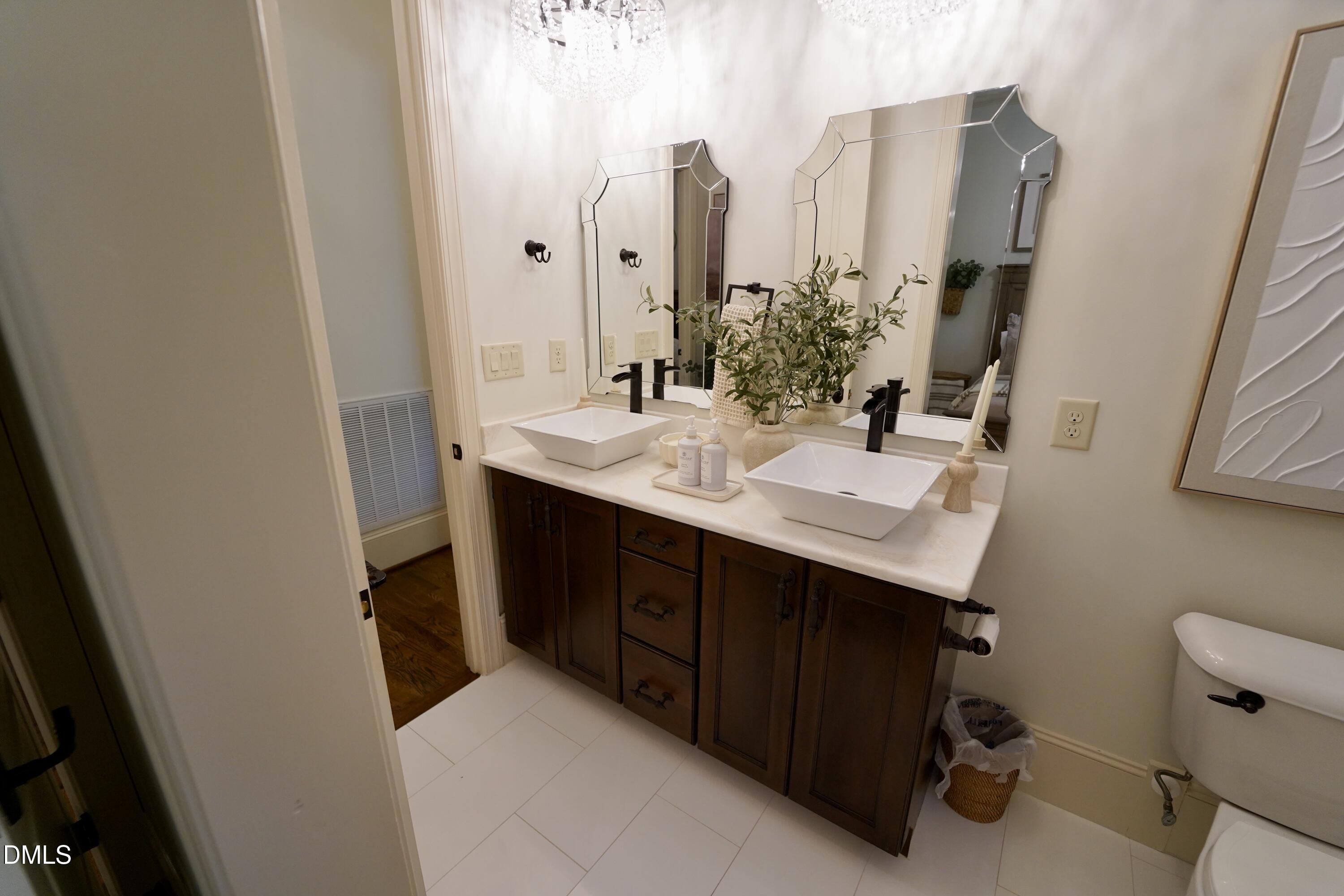 2604 Homestead Forest Road Zebulon, NC 27597 - Photo 82 of 101 a bathroom with a sink and a mirror