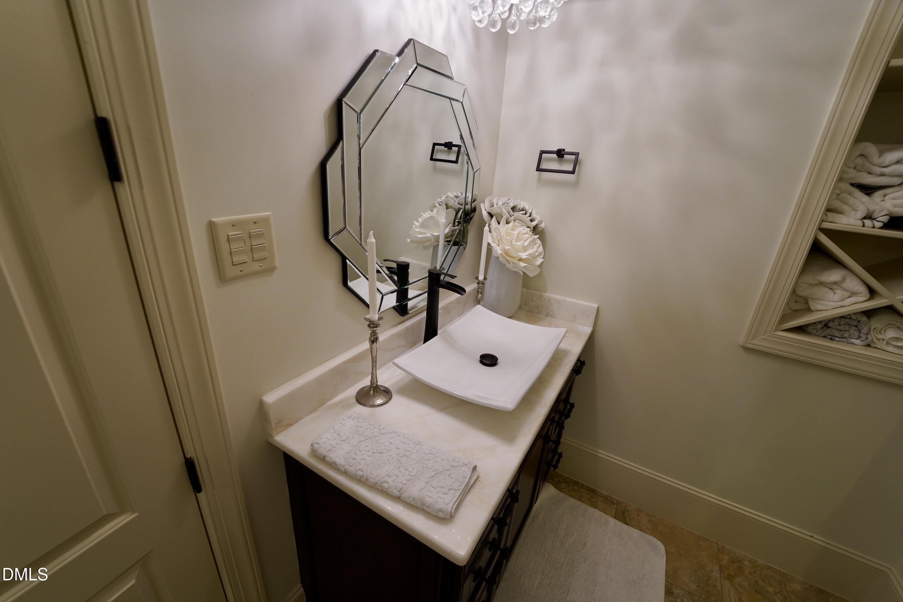 2604 Homestead Forest Road Zebulon, NC 27597 - Photo 94 of 101 a bathroom with a sink and a mirror