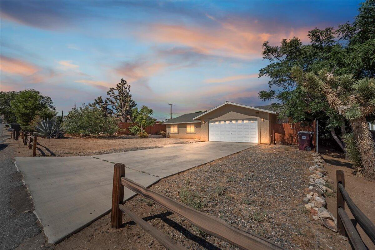 7562 Inca Trail Yucca Valley, CA 92284 - Photo 3 of 46 02-Front of Home at Twilight