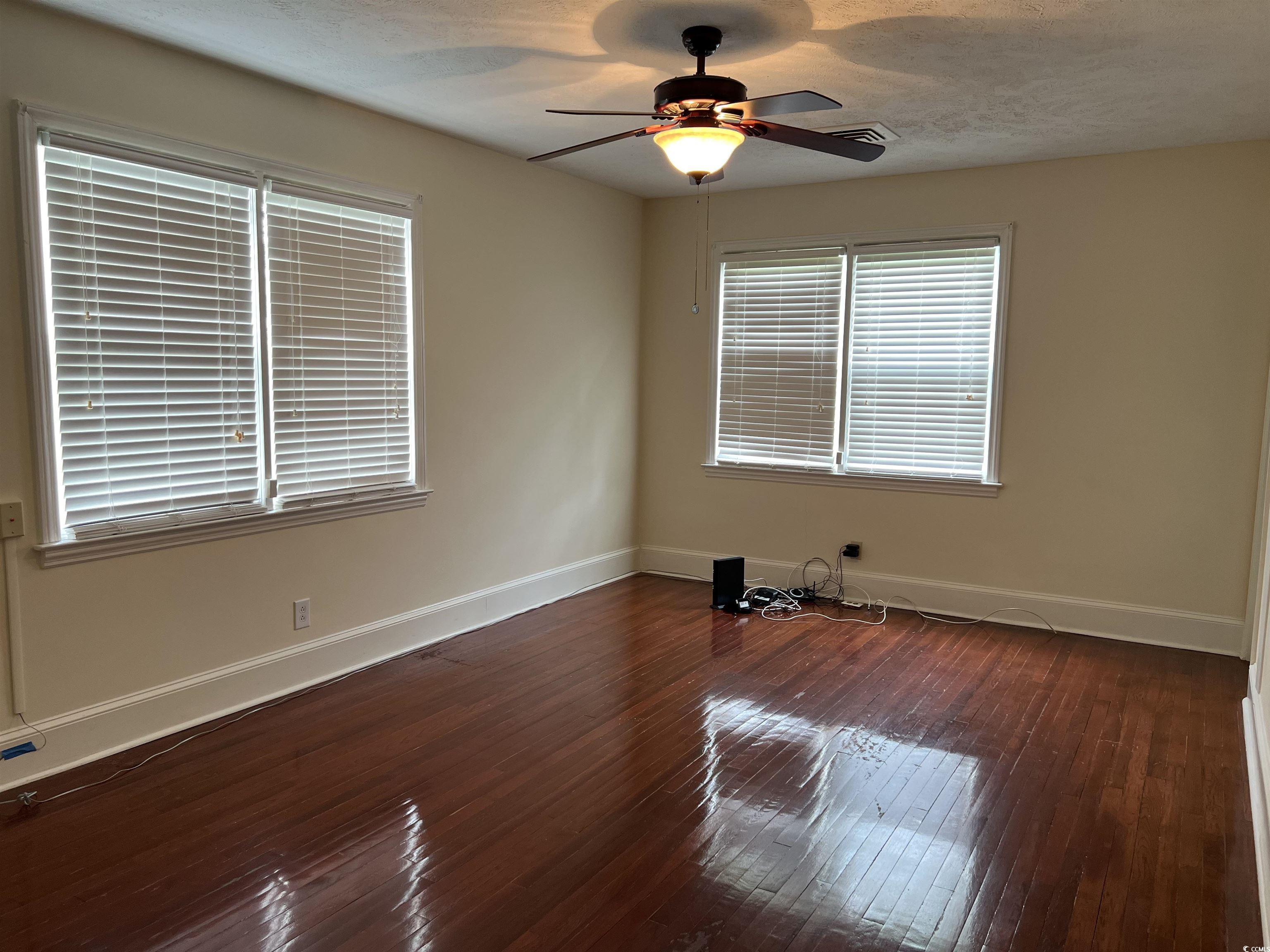 880 Horry Road Conway, SC 29526 - Photo 13 of 16 Empty room with dark hardwood / wood-style floorin