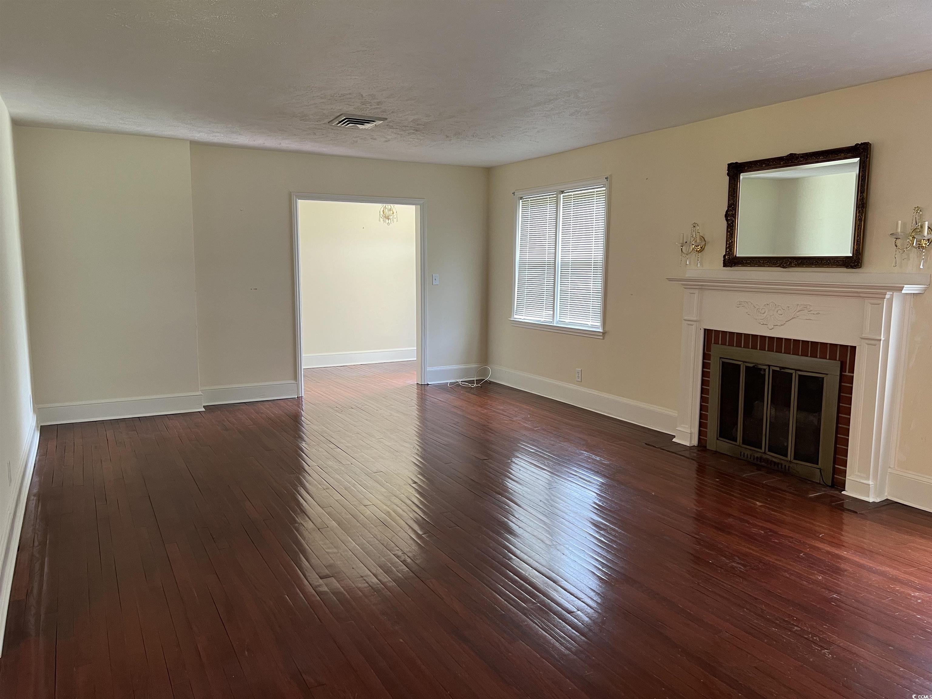 880 Horry Road Conway, SC 29526 - Photo 15 of 16 Unfurnished living room featuring hardwood / wood-