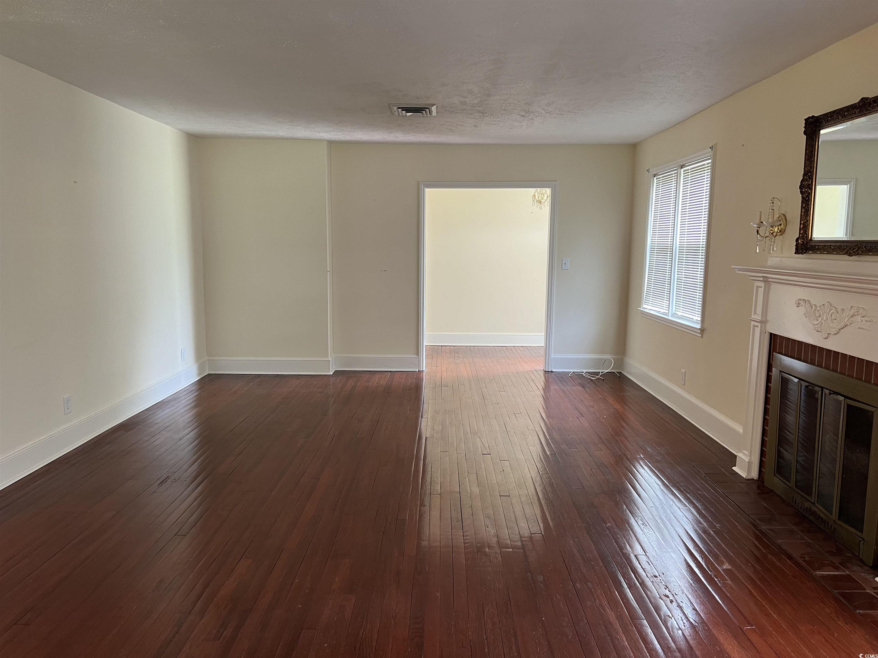 880 Horry Road Conway, SC 29526 - Photo 16 of 16 Unfurnished living room with a tiled fireplace and