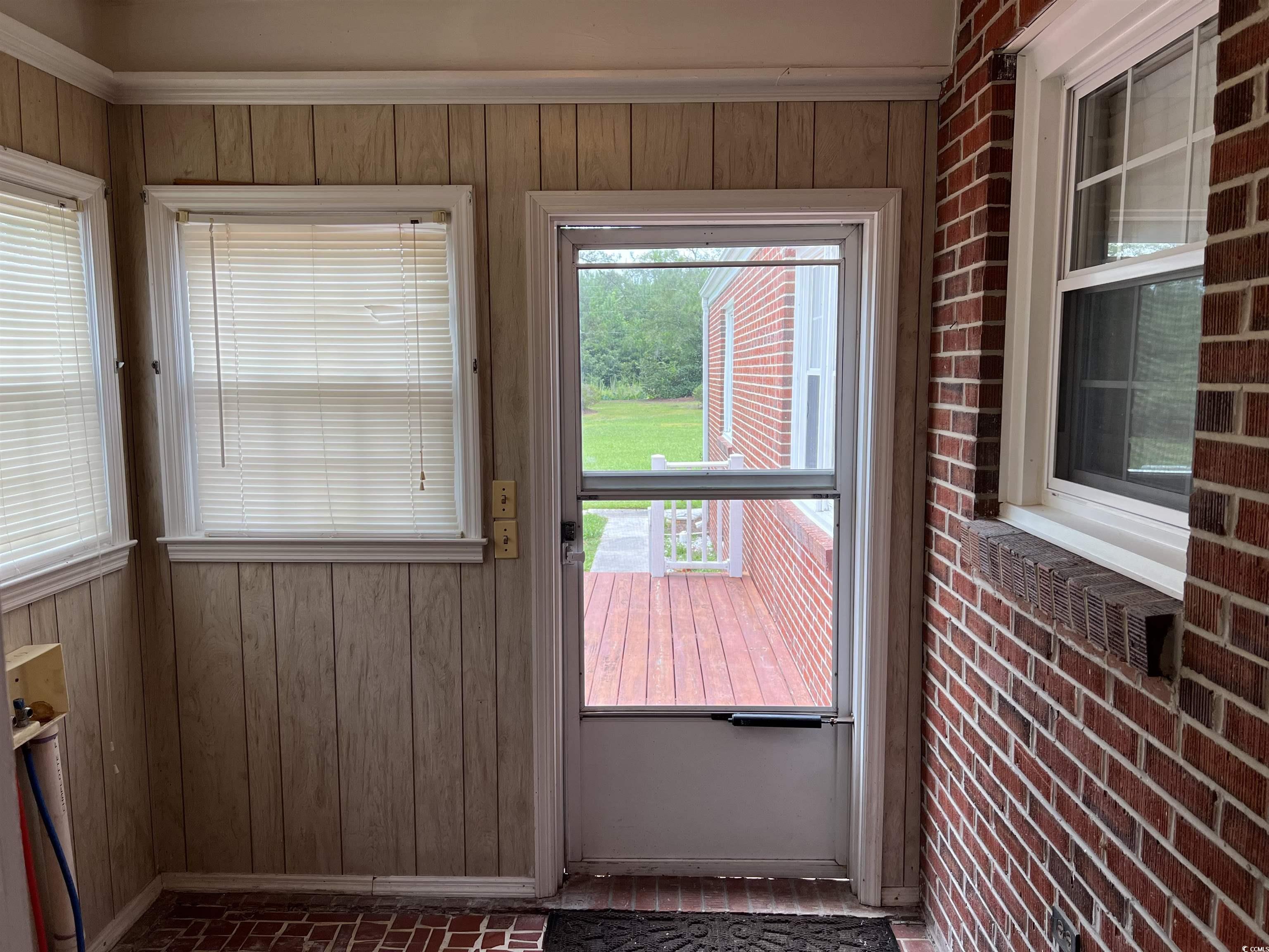 880 Horry Road Conway, SC 29526 - Photo 5 of 16 Entryway with wood walls