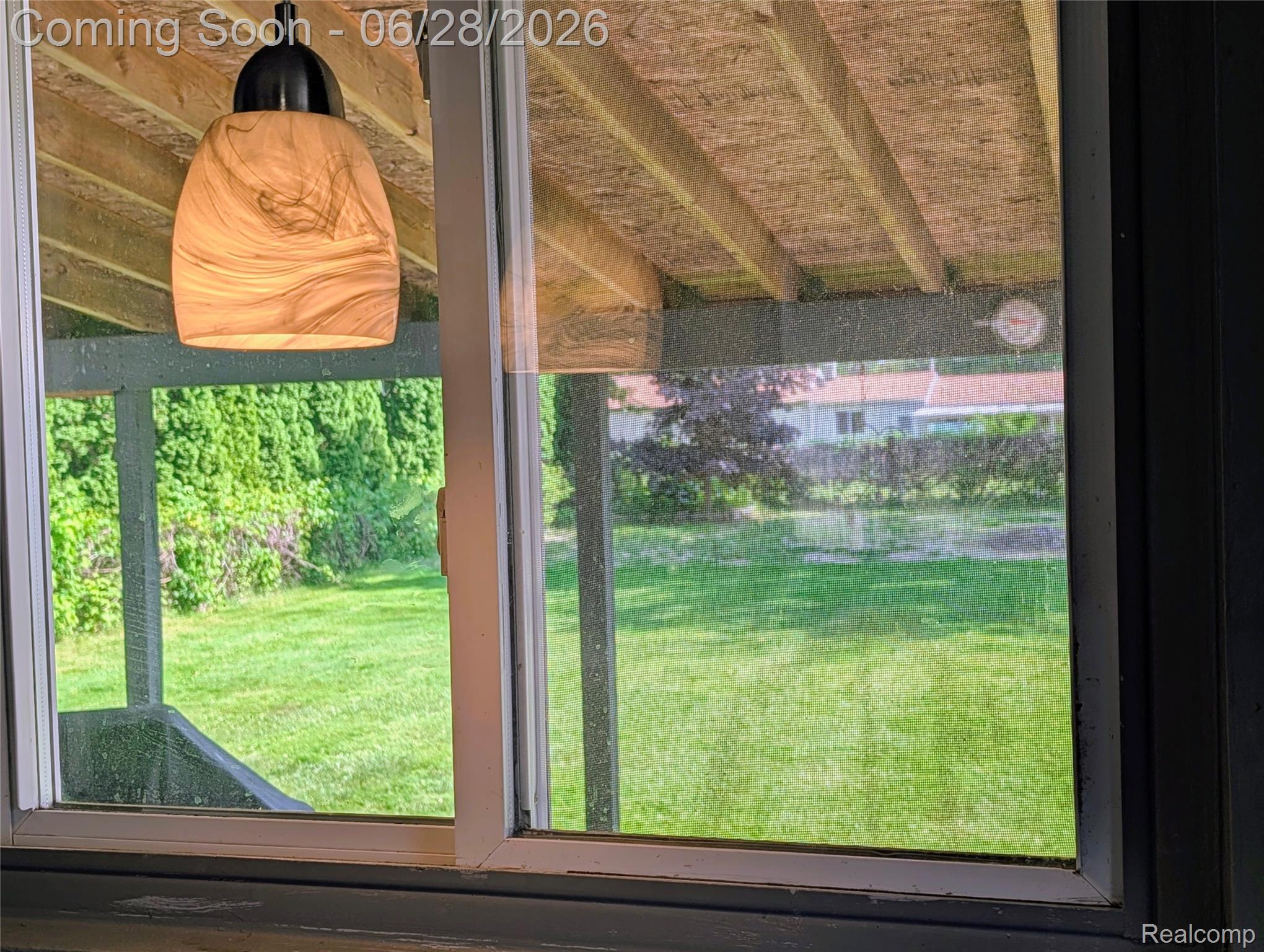 4456 East Coldwater Road Flint, MI 48506 - Photo 5 of 35 Contemporary pendant light fixture with a swirling glass shade