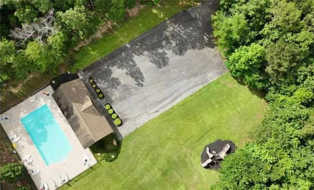 a backyard of a house with lots of green space