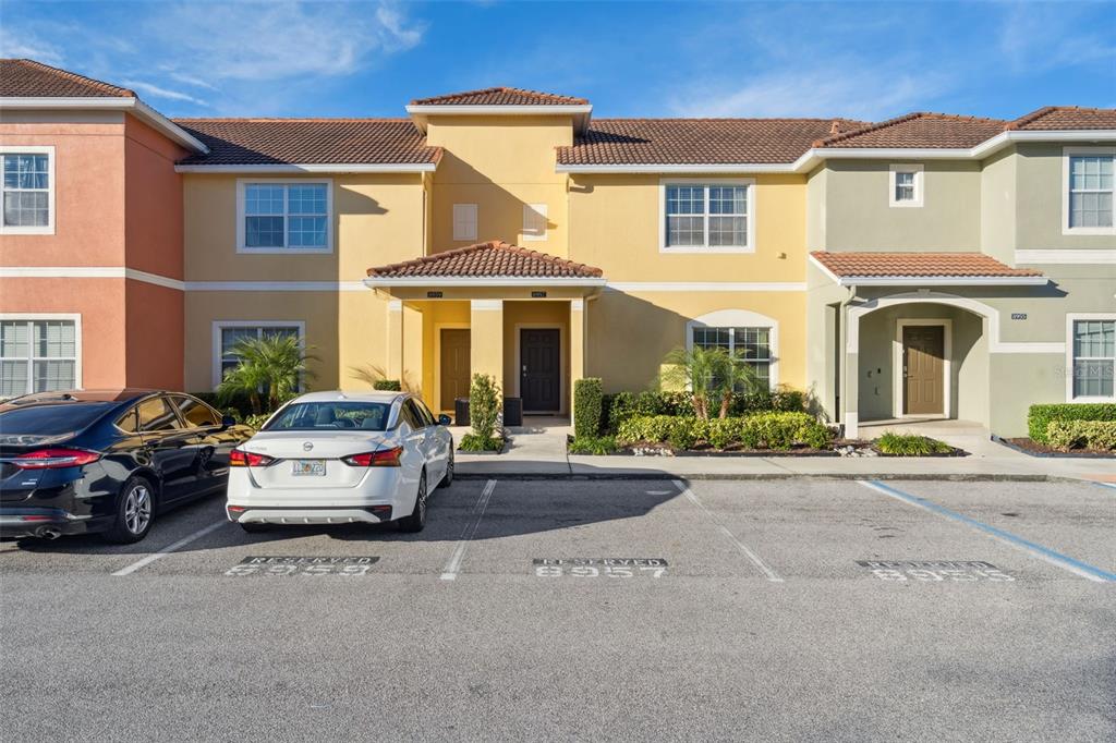 8957 Sugar Palm Road Kissimmee, FL 34747 - Photo 1 of 68 front view of a house with a cars parked in front of it