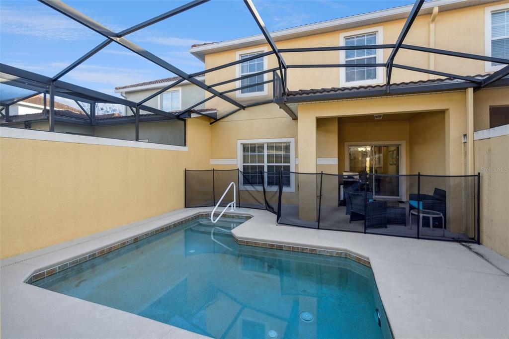 8957 Sugar Palm Road Kissimmee, FL 34747 - Photo 22 of 68 a view of a living room with a couch