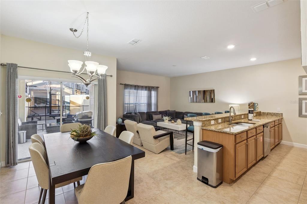 8957 Sugar Palm Road Kissimmee, FL 34747 - Photo 4 of 68 a kitchen that has a lot of cabinets in it
