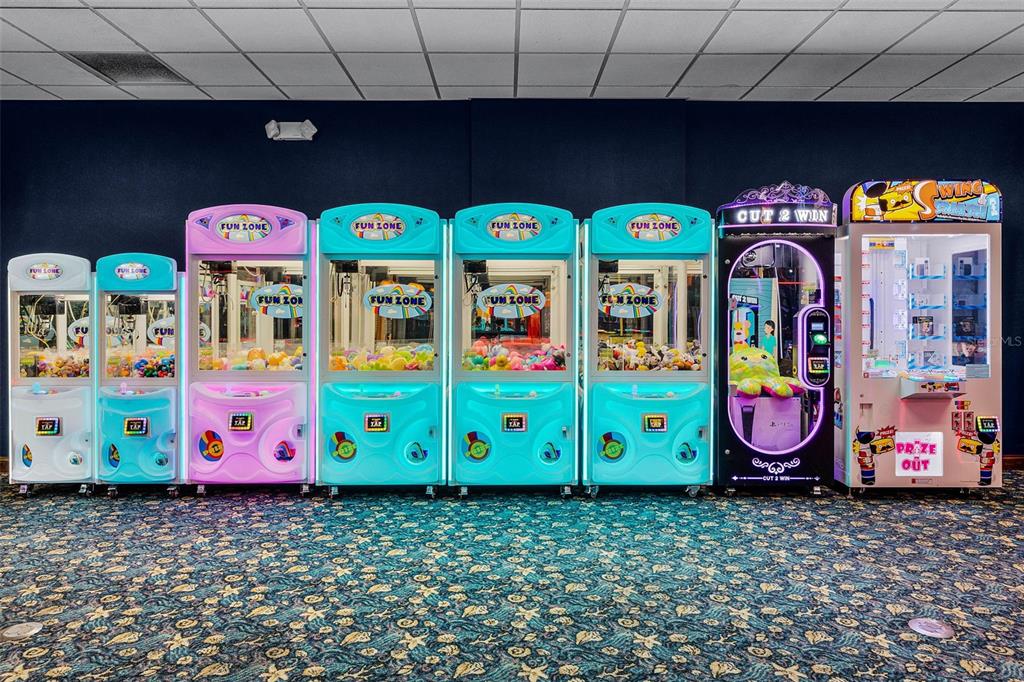 8957 Sugar Palm Road Kissimmee, FL 34747 - Photo 64 of 68 a front view of a multi story building with retail shop and refrigerator