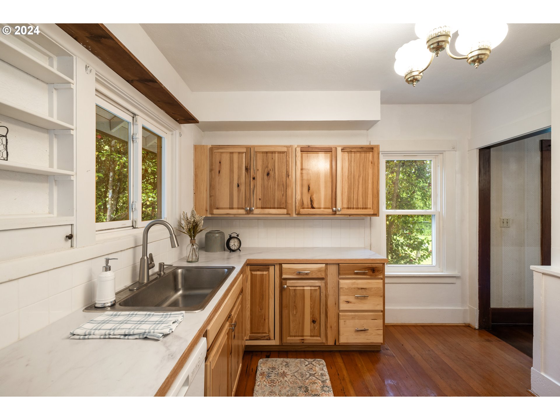 140 Southeast Lamson Street Willamina, OR 97396 - Photo 11 of 46 a kitchen with a stove a sink and a window