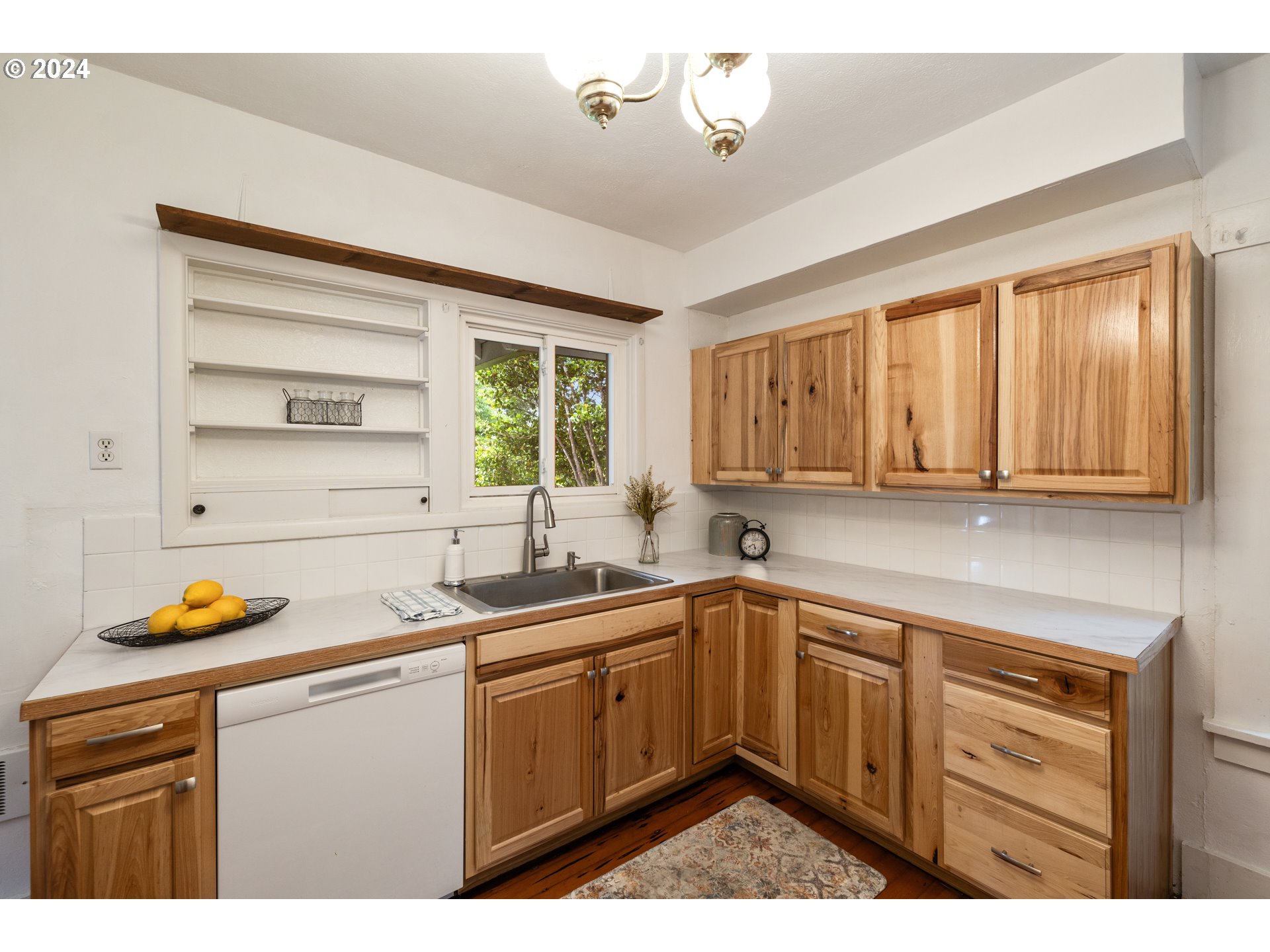 140 Southeast Lamson Street Willamina, OR 97396 - Photo 12 of 46 a kitchen with a sink stove and cabinets