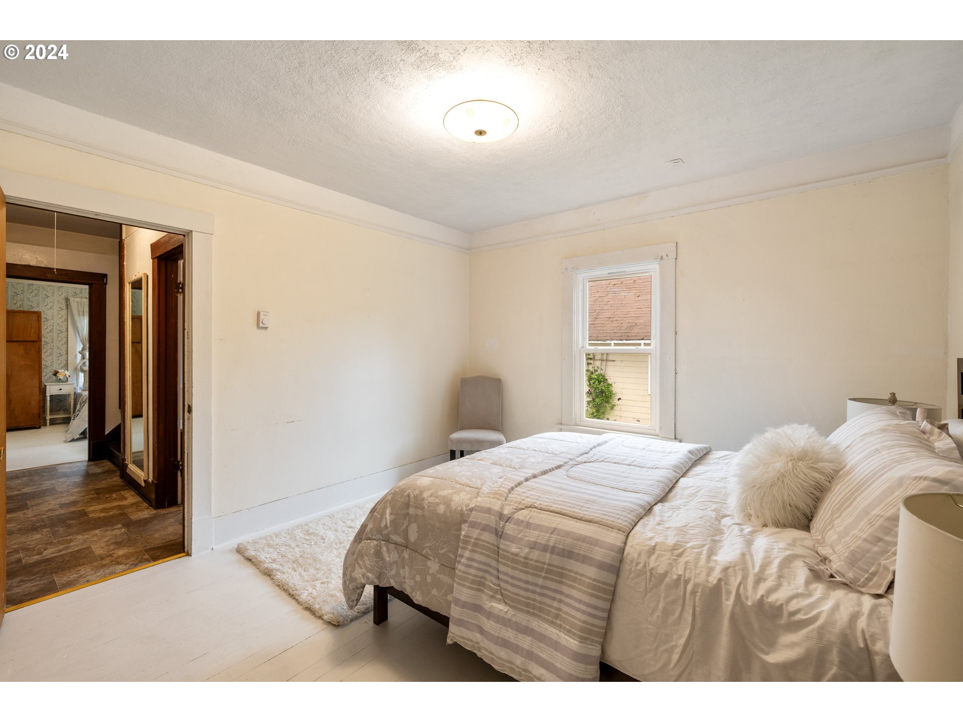 140 Southeast Lamson Street Willamina, OR 97396 - Photo 14 of 46 a bedroom with a bed and a window