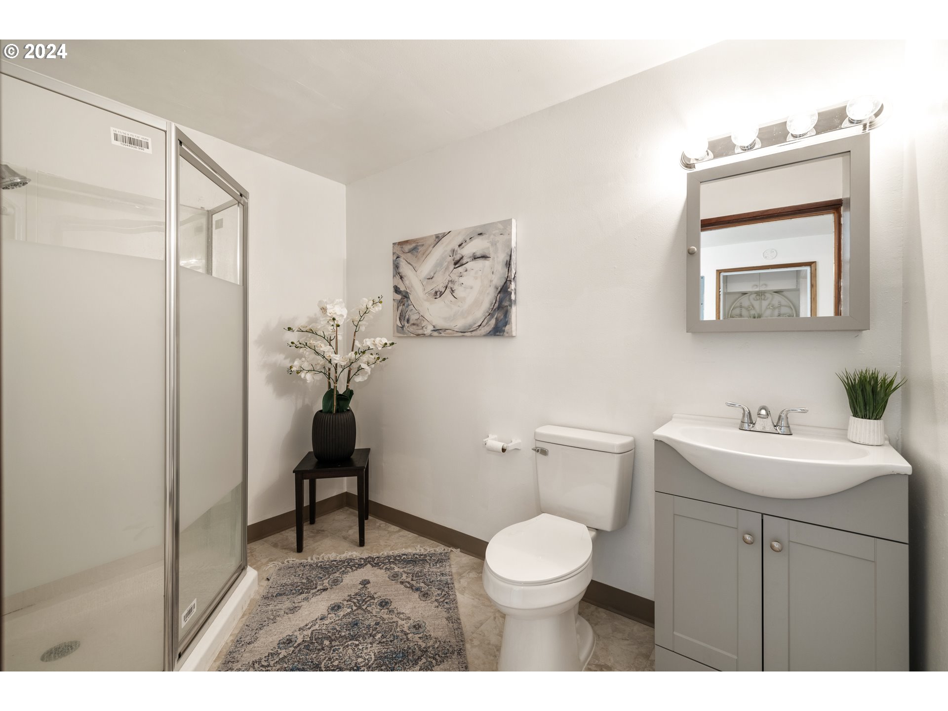 140 Southeast Lamson Street Willamina, OR 97396 - Photo 19 of 46 a bathroom with a toilet sink and mirror