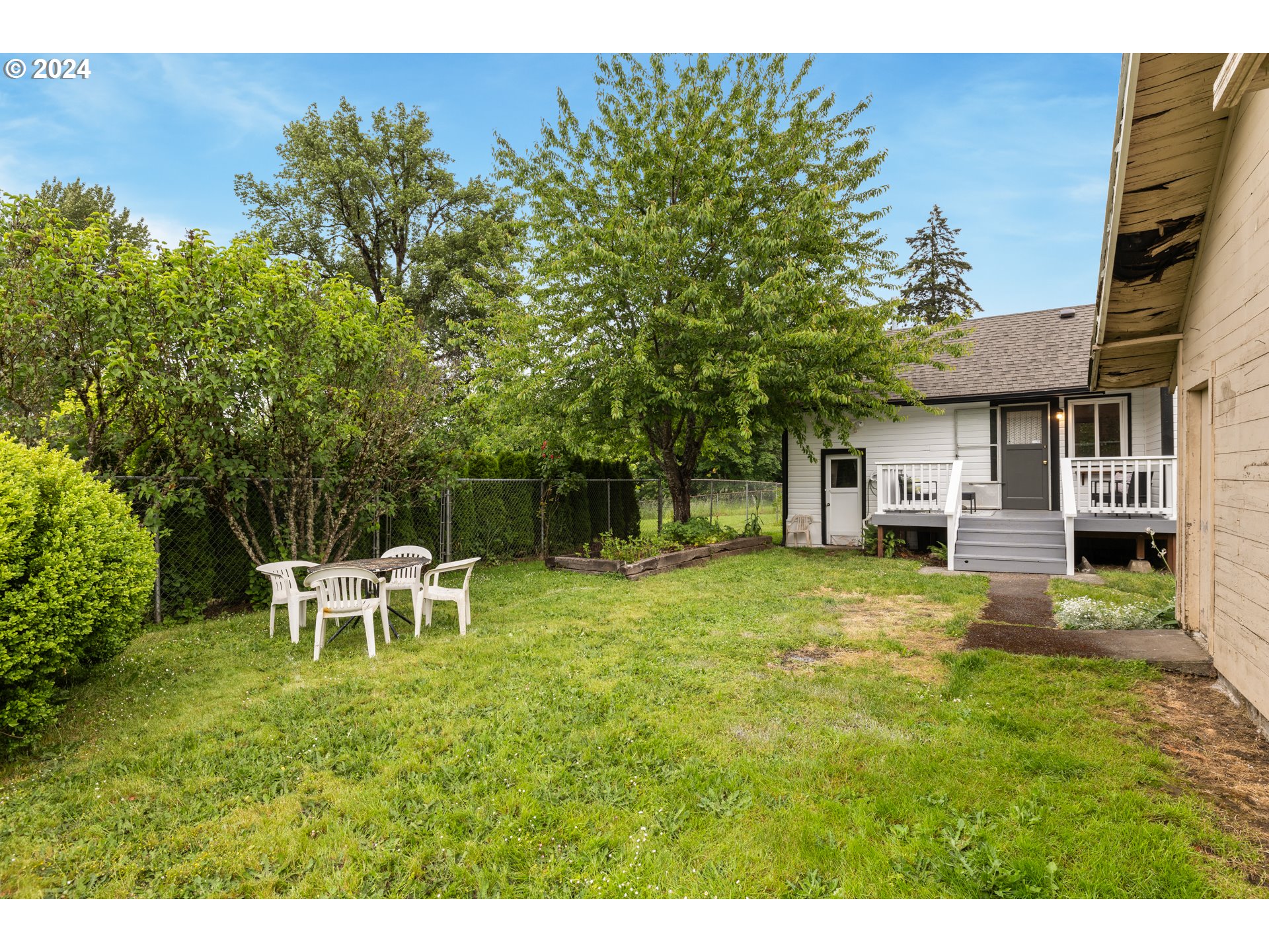 140 Southeast Lamson Street Willamina, OR 97396 - Photo 29 of 46 a view of a house with backyard and a sitting area