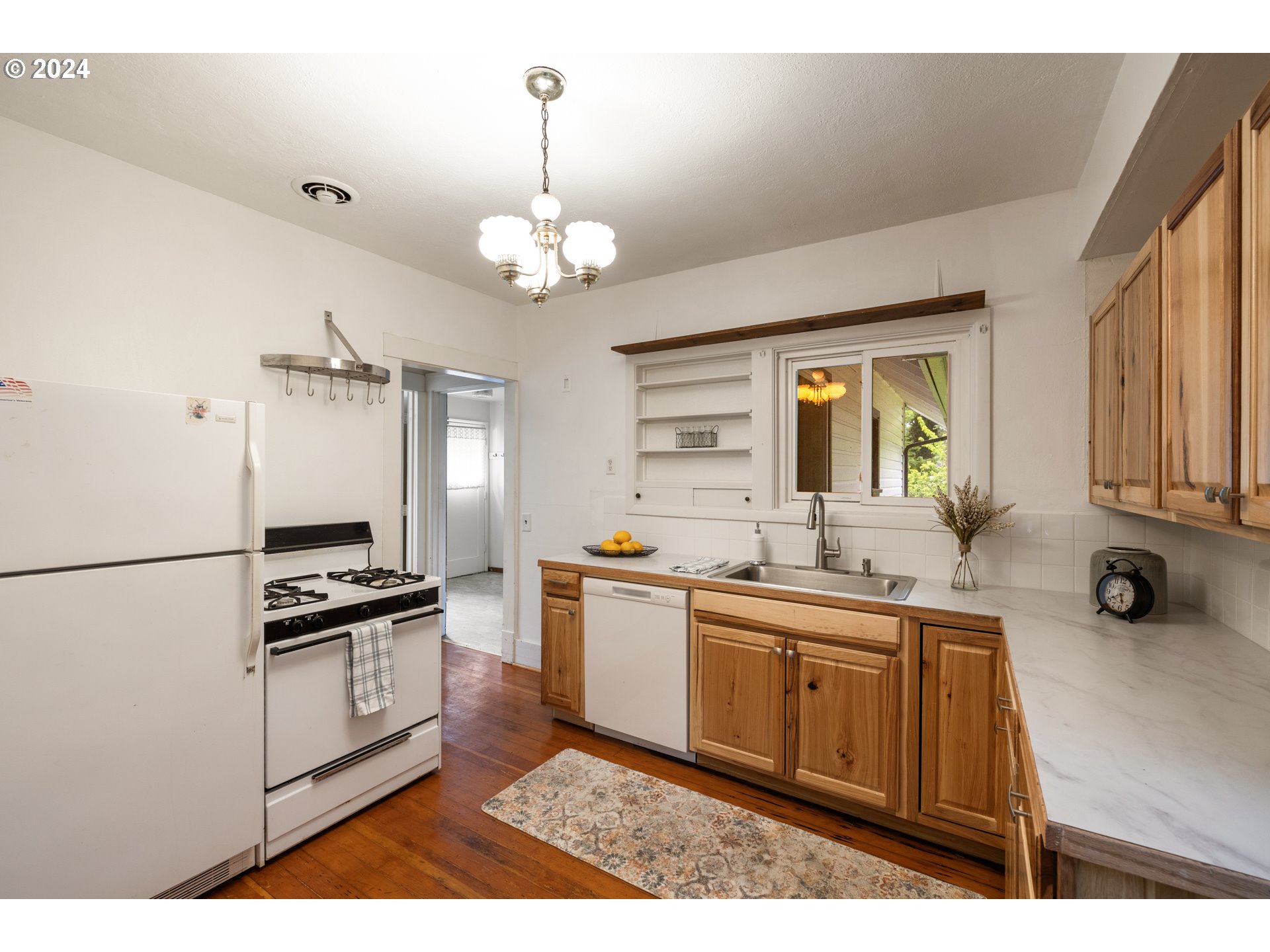 140 Southeast Lamson Street Willamina, OR 97396 - Photo 10 of 46 a kitchen with stainless steel appliances a sink stove and refrigerator