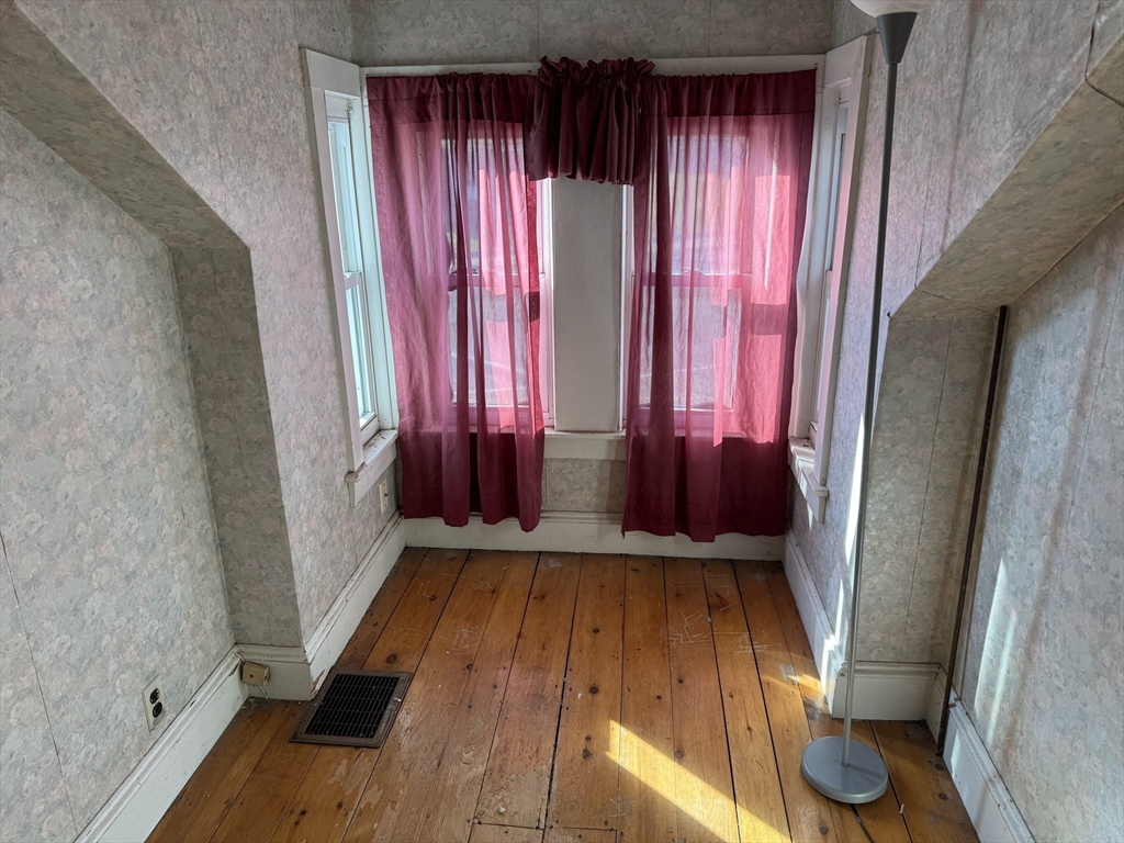 100 Poplar Street Danvers, MA 01923 - Photo 11 of 24 a view of a room with wooden floor and glass windows