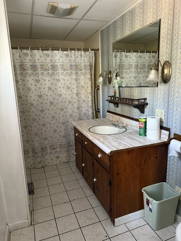 100 Poplar Street Danvers, MA 01923 - Photo 13 of 24 a bathroom with a sink and a mirror