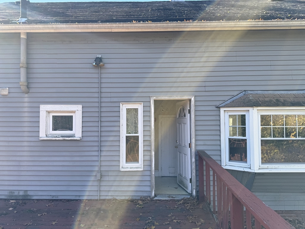 100 Poplar Street Danvers, MA 01923 - Photo 17 of 24 a view of a house with a balcony