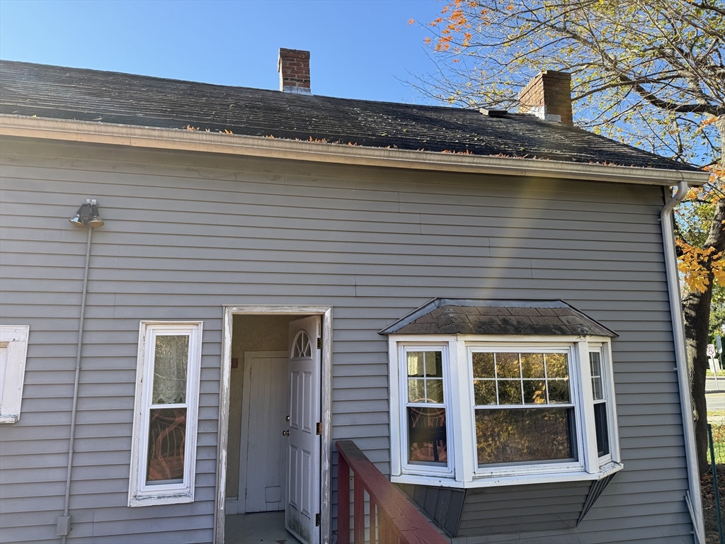 100 Poplar Street Danvers, MA 01923 - Photo 24 of 24 a front view of a house with a glass windows