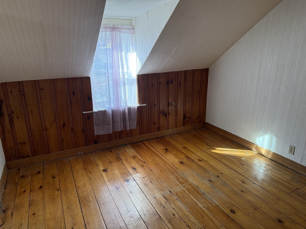 100 Poplar Street Danvers, MA 01923 - Photo 9 of 24 a view of wooden floor and brick walls