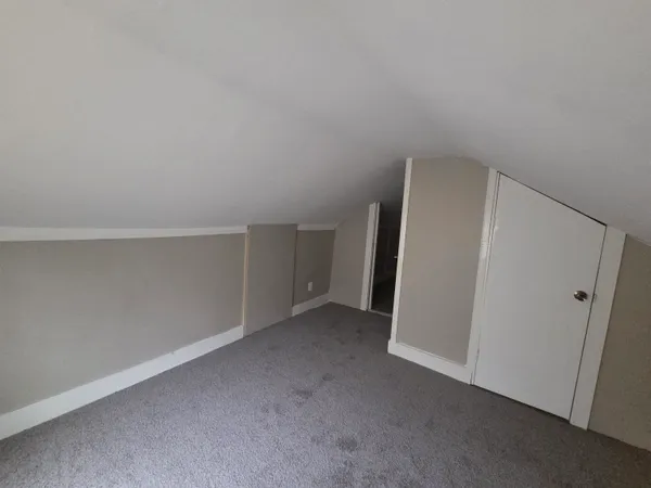 a view of a bathroom from a hallway
