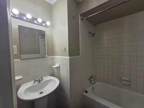 a bathroom with a bathtub and a toilet