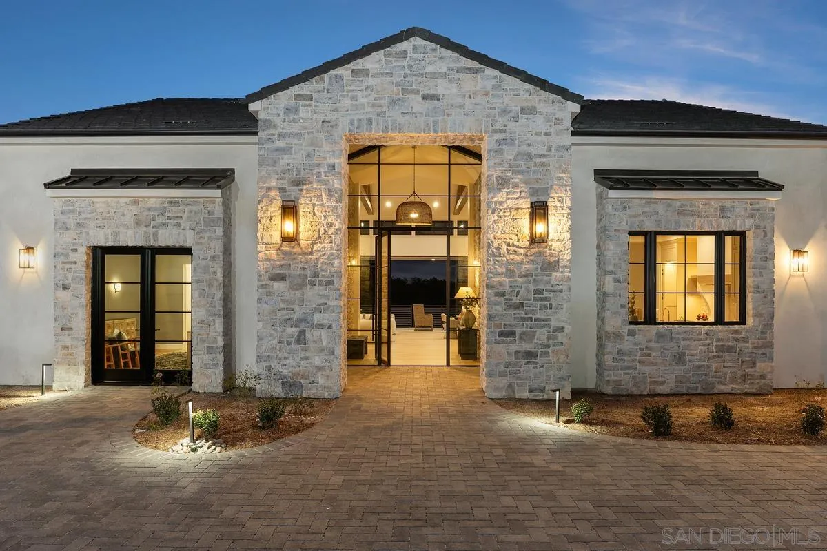 an entrance to house with yard