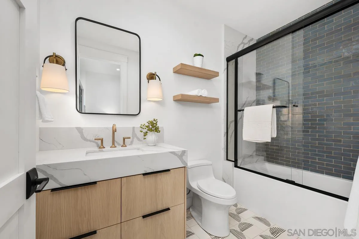 6691-93 Camino Saucito Rancho Santa Fe, CA 92067 - Photo 45 of 55 a bathroom with a sink a toilet and shower