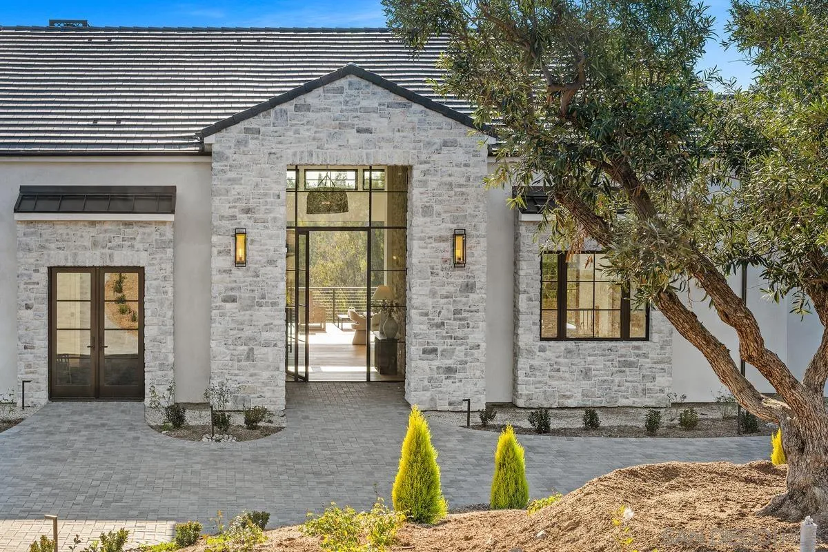 6691-93 Camino Saucito Rancho Santa Fe, CA 92067 - Photo 55 of 55 a front view of a house with garden