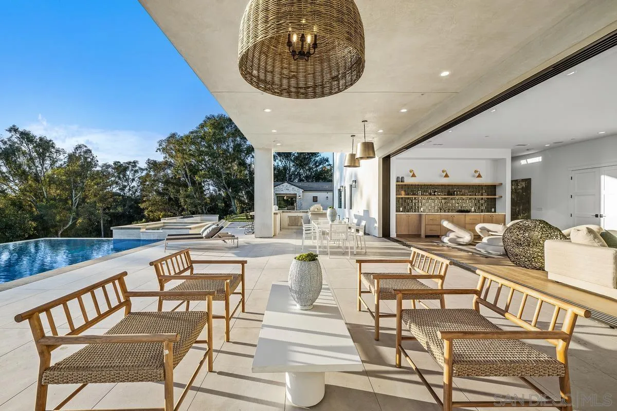 6691-93 Camino Saucito Rancho Santa Fe, CA 92067 - Photo 6 of 55 a view of a dining room with furniture window and wooden floor