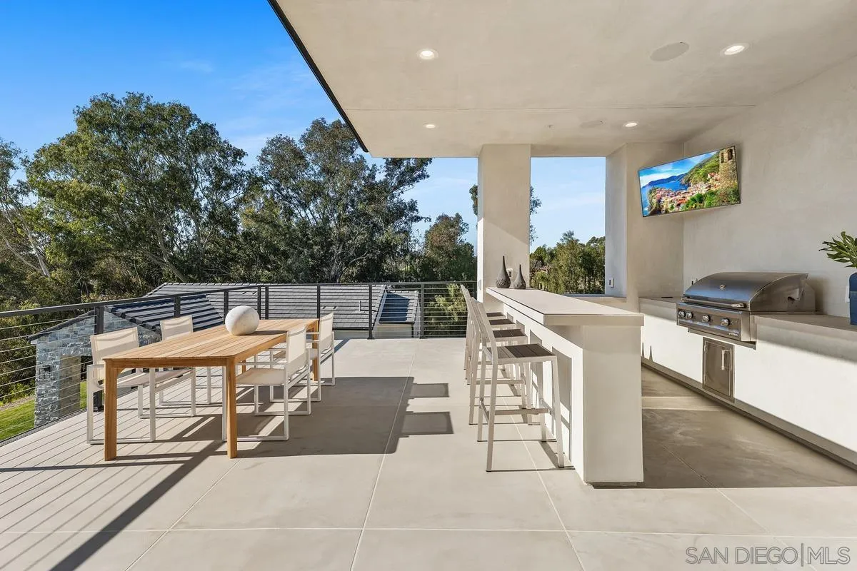 6691-93 Camino Saucito Rancho Santa Fe, CA 92067 - Photo 7 of 55 a outdoor space with a large window and furniture