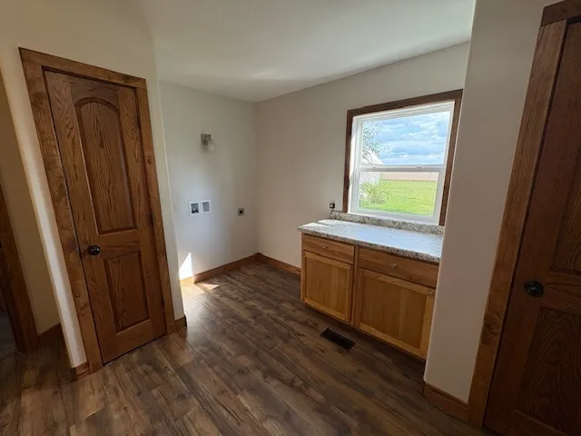 a view of a kitchen from the hallway
