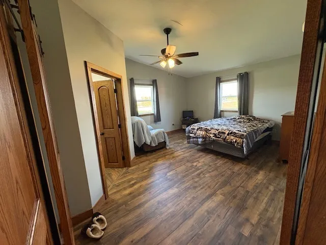 a bedroom with bed and window