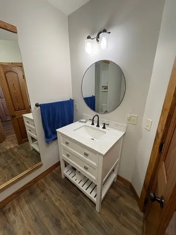 a bathroom with a sink and a mirror