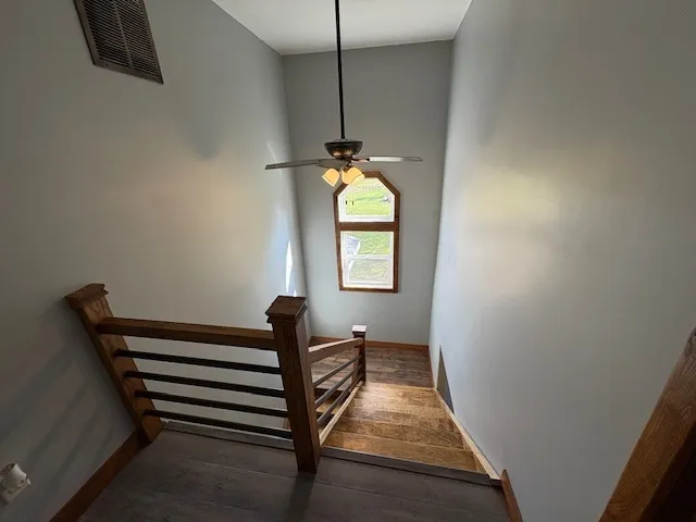a view of entryway and hall with wooden floor