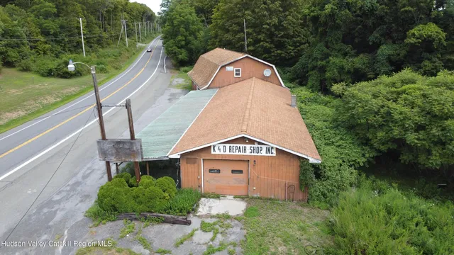a view of a wooden fence next to a yard