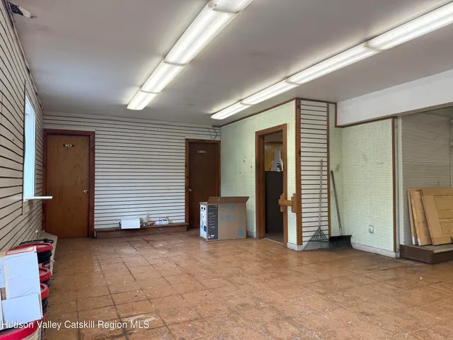 an empty room with furniture and a window